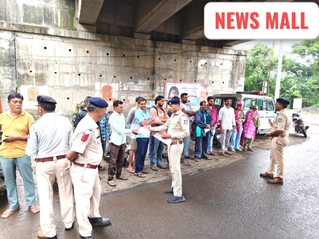 Gujarat traffic police checking vehicles for fancy and missing number plates during a special mega drive