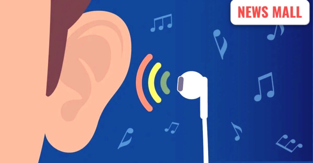 Person covering ears near loud DJ speakers at a wedding party in India