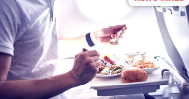 Two pilots sitting in an airplane cockpit following aviation safety and separate meal protocols.